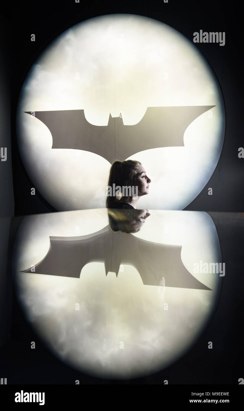DC Comics Dawn of the Super Heroes Exhibit London Premiere Featuring: A  member of the Exhibition team in front of a Batman Logo Where: London,  United Kingdom When: 22 Feb 2018 Credit: