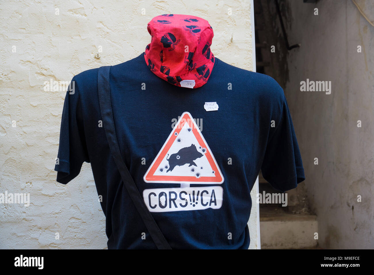 T-shirt with a riddled traffic sign at a souvenir shop, old town of Bonifacio, Corsica, France, Mediterranean, Europe Stock Photo