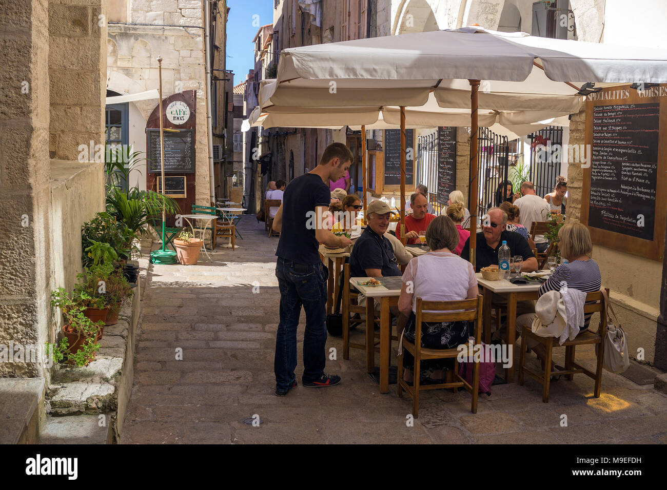 Bar and restaurant at a narrow alley, old town of Bonifacio, Corsica, France, Mediterranean, Europe Stock Photo