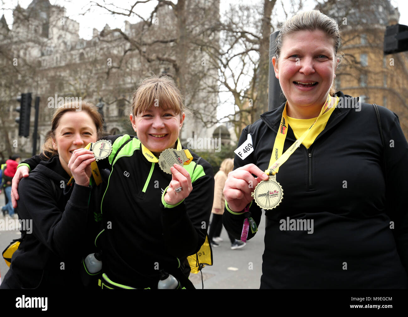 Runners pose with their medals after completing the 2018 London Landmarks Half Marathon. PRESS ASSOCIATION Photo. Picture date: Sunday March 25, 2018. Photo credit should read: Steven Paston/PA Wire Stock Photo