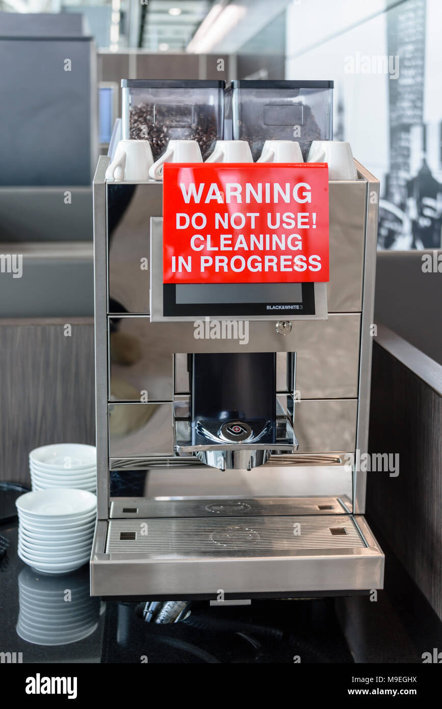 Coffee machine out of service due to cleaning at a hotel airport business lounge. Stock Photo
