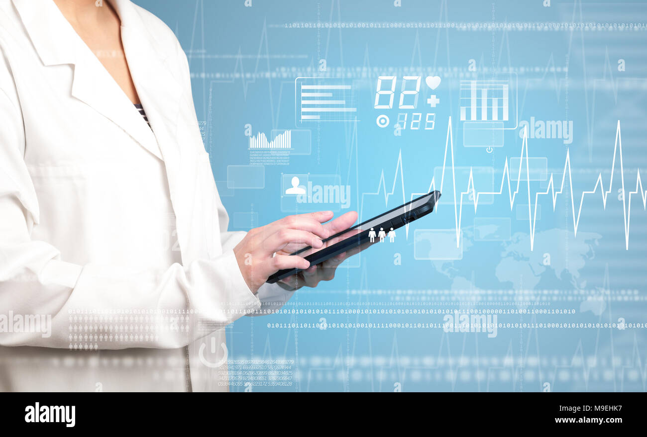 Female doctor holding tablet with blue background and heart related ...