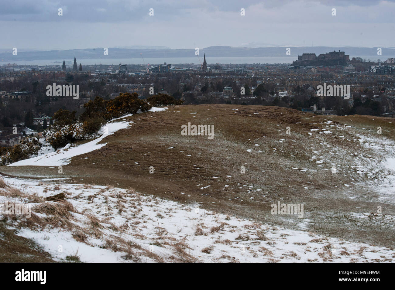 A view from high above Edinburgh in half light with Edinburgh Castle