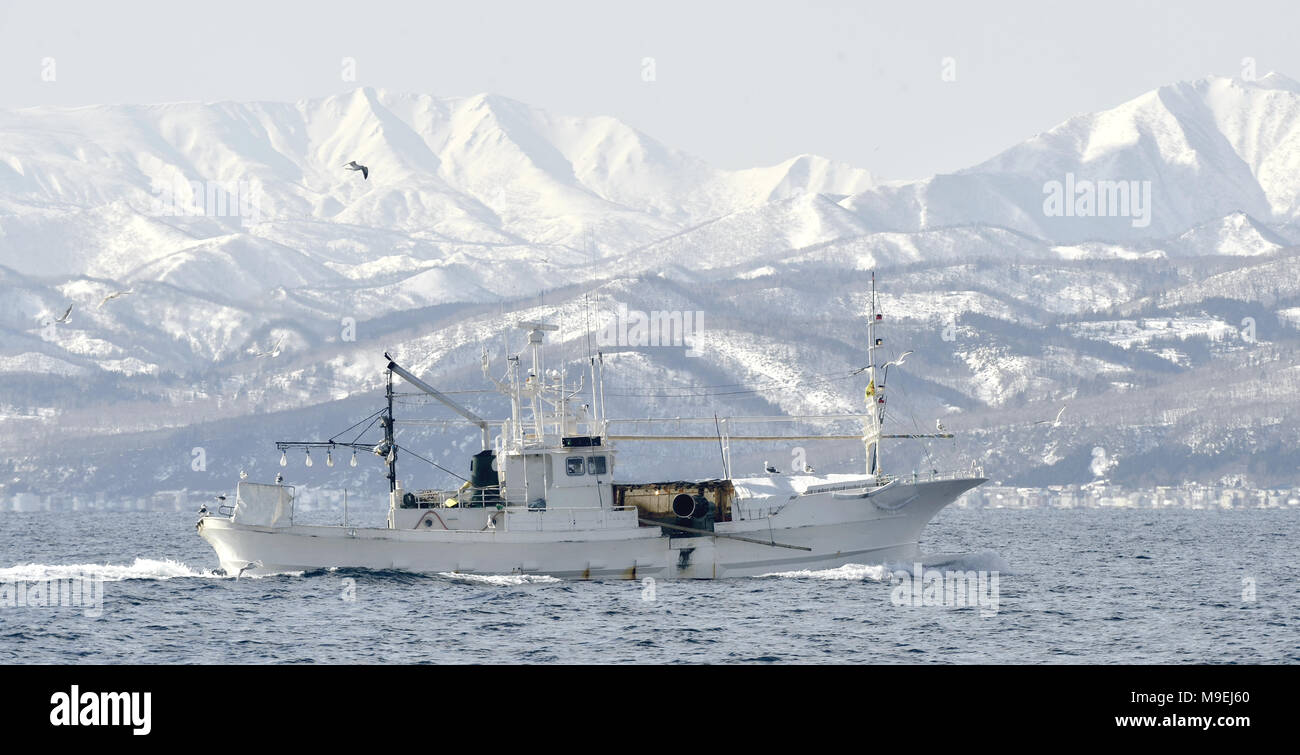 Japanese fishing vessels in the Sea of Okhotsk off the island of Kunashir. Winter season. Stock Photo