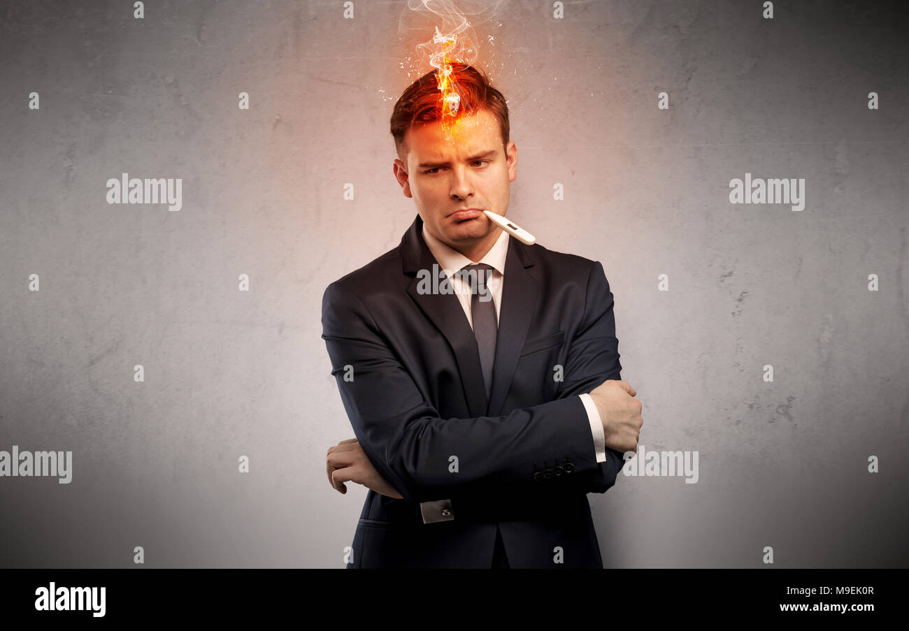 Fever businessman with burning head concept Stock Photo Alamy