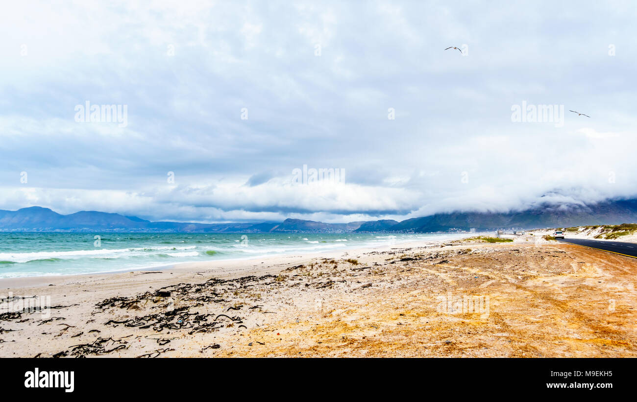 The beautiful beaches on False Bay along Baden Powell Drive between  Macassar and Muizenberg near Cape Town, South Africa Stock Photo - Alamy