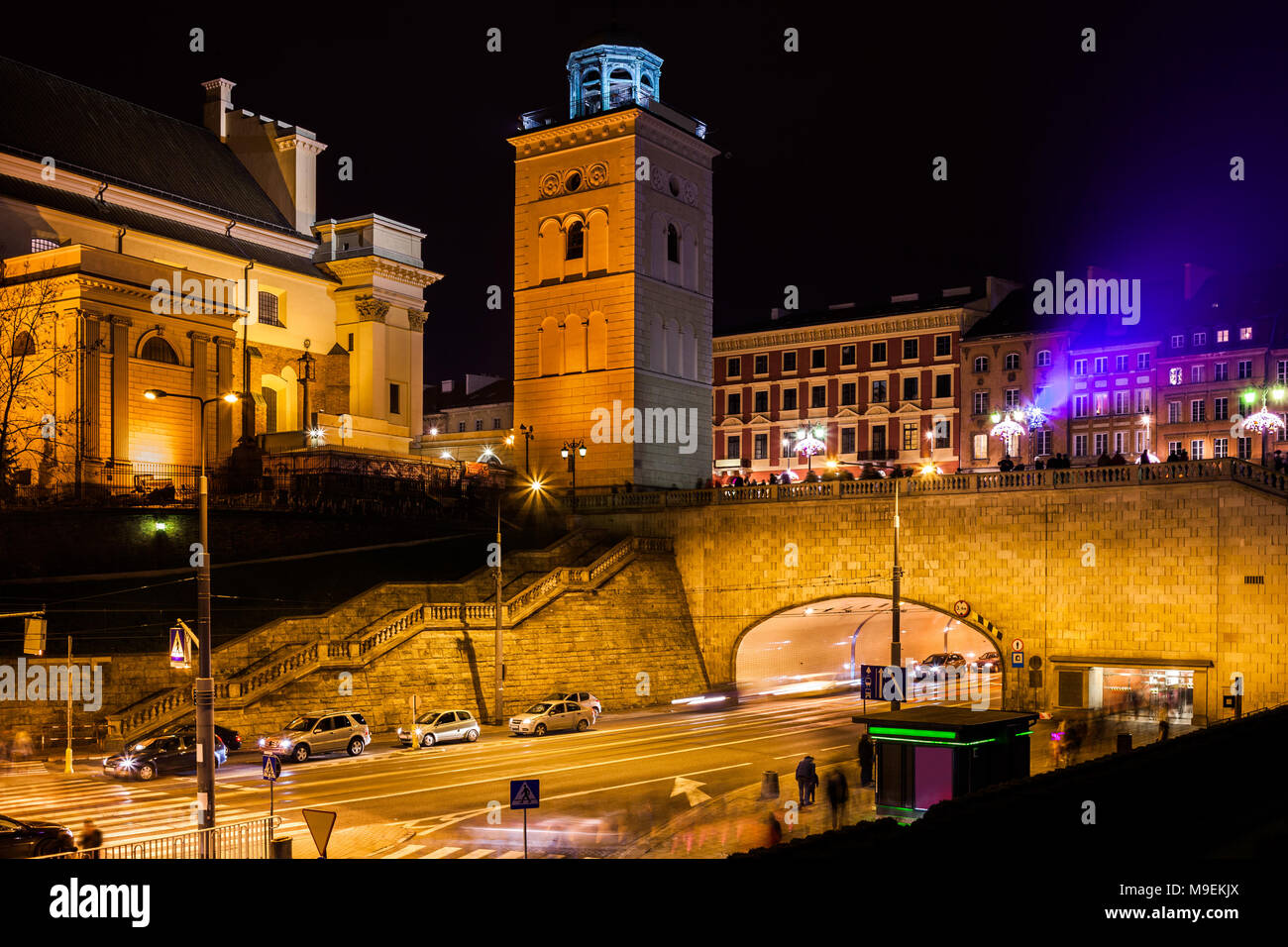 City of Warsaw at night in Poland, St. Anne's Church, Solidarity Avenue street with tunnel under the Old Town Stock Photo