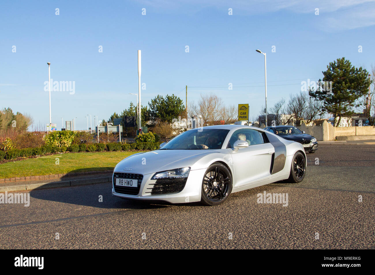 2008 silver Audi R8 4.2 Quattro S-A 4163cc petrol coupe at the North-West Supercar event as cars and tourists arrive in the coastal resort. Cars are bumper to bumper on the seafront esplanade as classic & sports car enthusiasts take advantage of warm weather for a motoring day out. Stock Photo