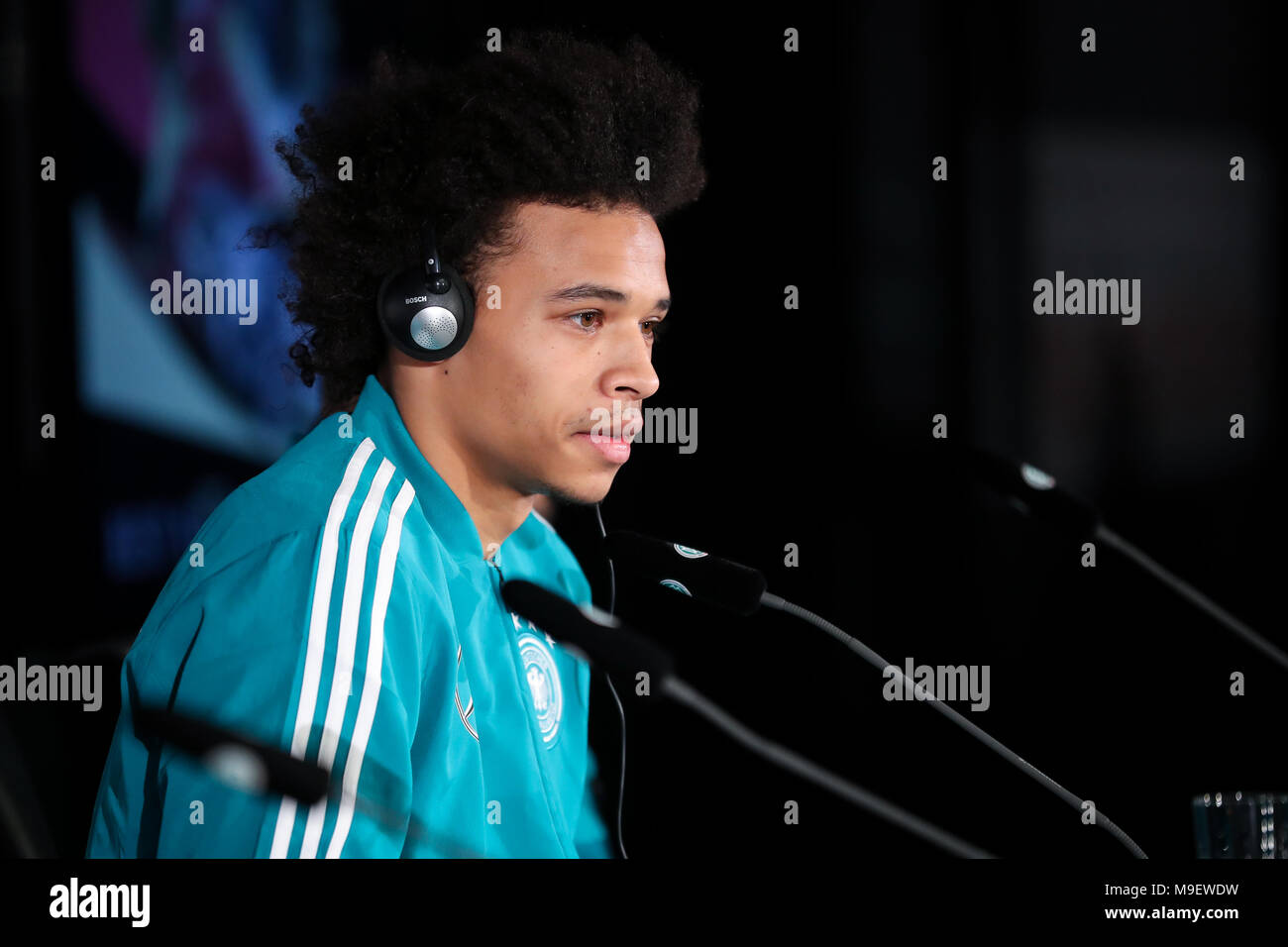 25 March 2018, Germany, Berlin: The German national team gives a press conference shortly before their game against Brazil. Player Leroy Sane appears on stage. Photo: Christian Charisius/dpa Stock Photo