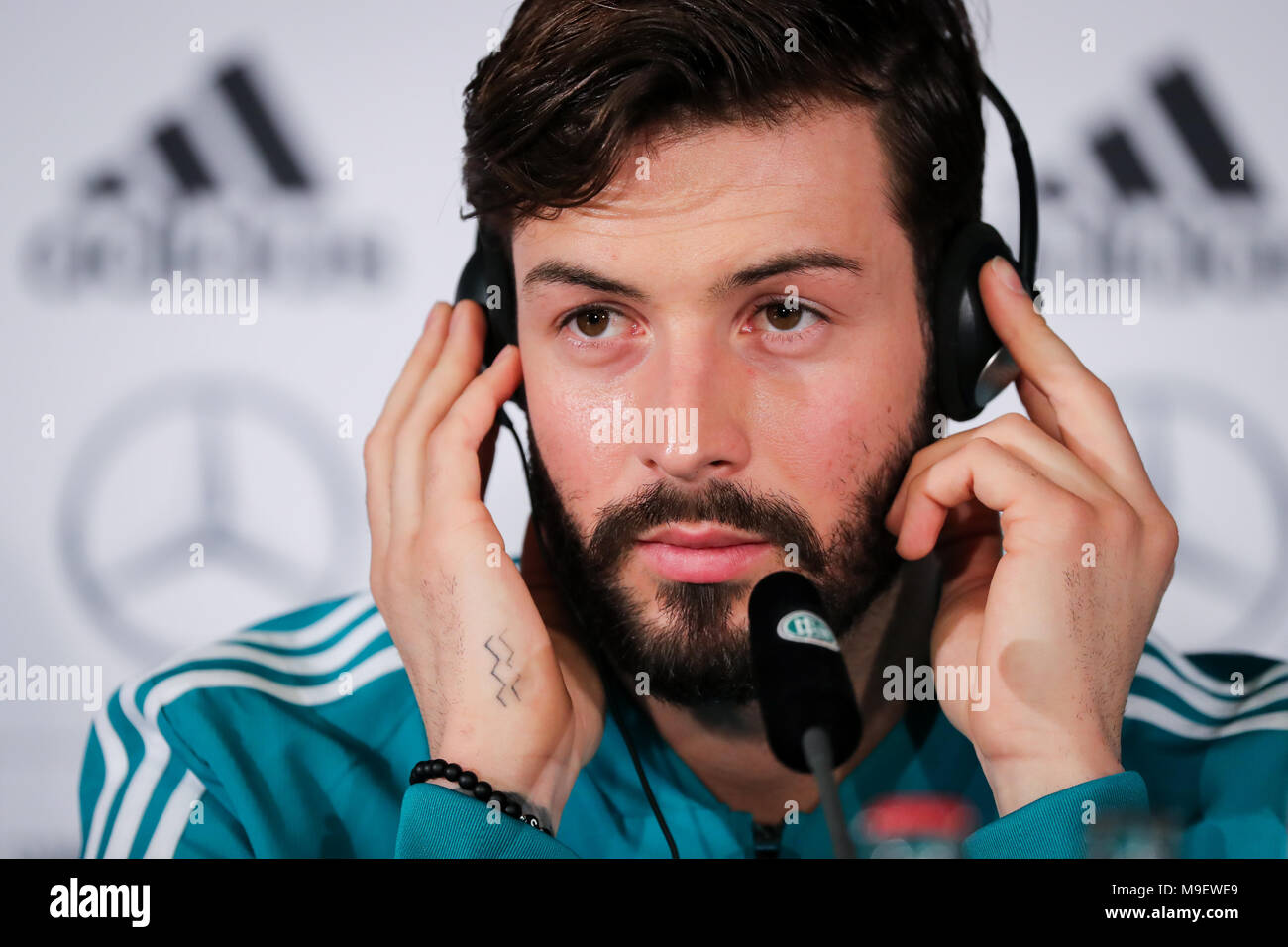 25 March 2018, Germany, Berlin: The German national team gives a press conference shortly before their game against Brazil. Player Marvin Plattenhardt appears on stage. Photo: Christian Charisius/dpa Stock Photo