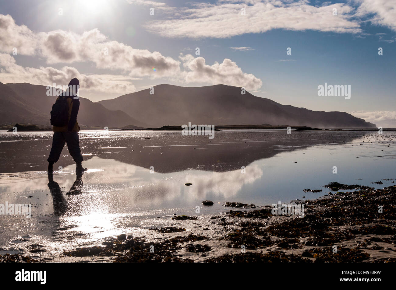 Ardara, County Donegal, Ireland weather. March 25th 2018. A beach walker enjoys the fine weather on Ireland's 'Wild Atlantic Way' coastline. Photo by : Richard Wayman Stock Photo