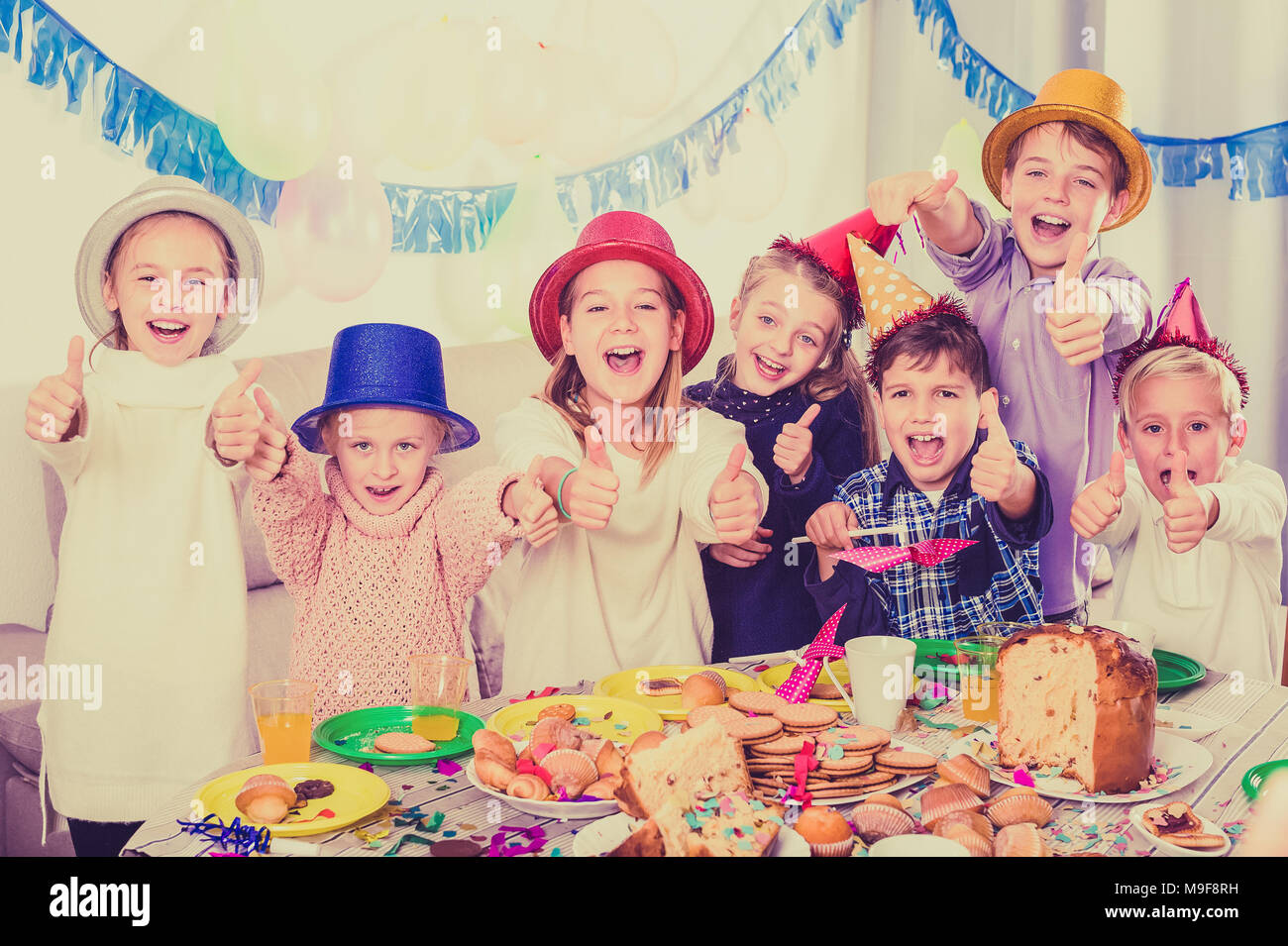 Smiling of children happy to celebrate friend’s birthday during dinner