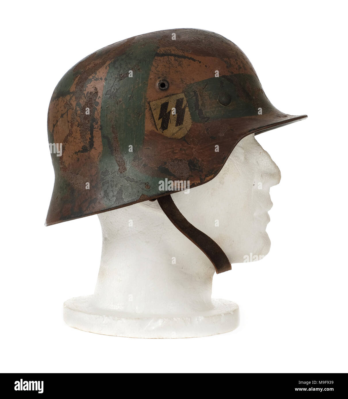 WW2 German Third Reich 'SS' steel helmet (M40 Stahlhelm) from 1940 with original Swastika and SS decals, made by Eisen und Huttenwerke A.G. Thale. Stock Photo