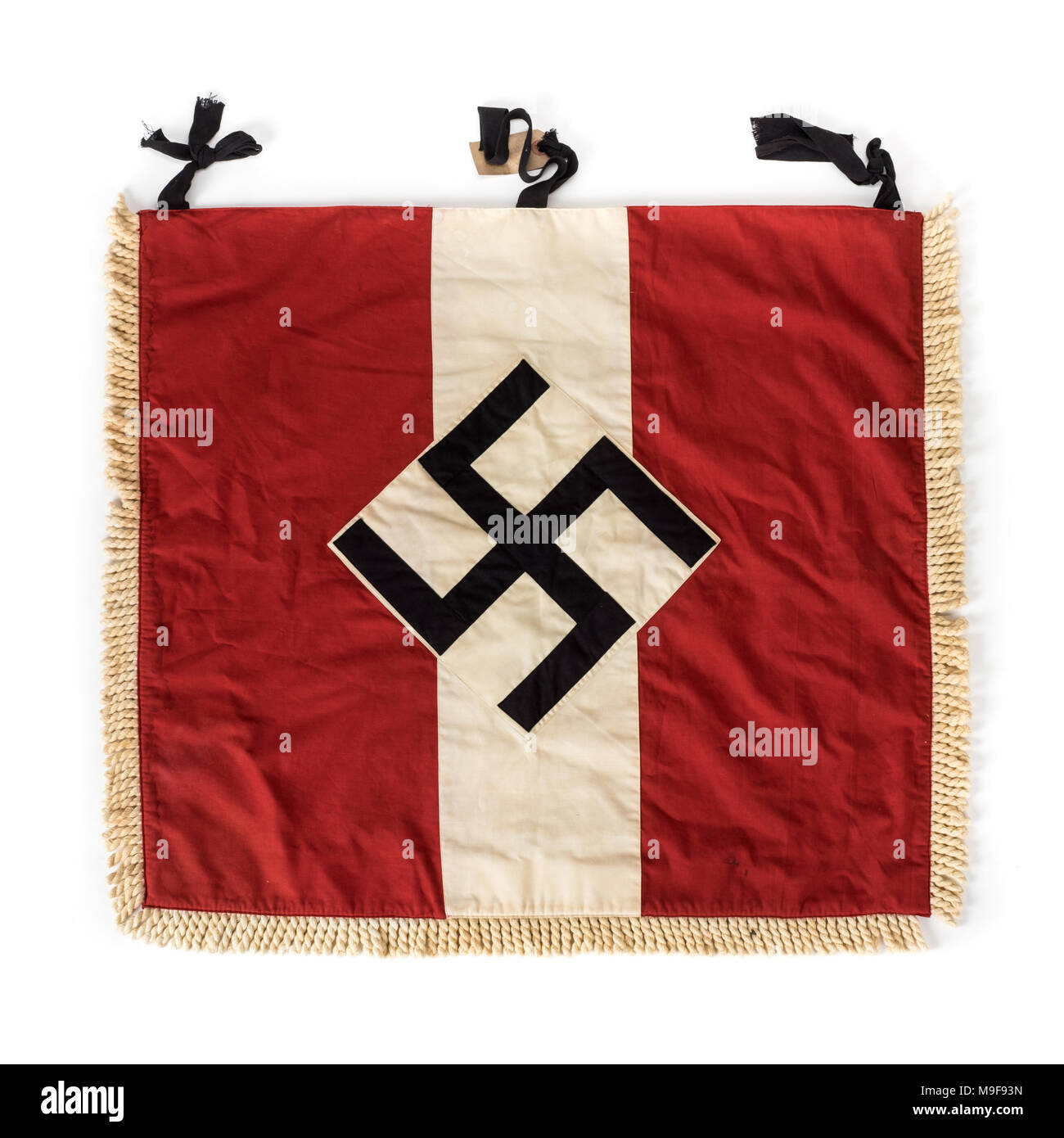 WW2 German Third Reich Hitler Youth red and white trumpet banner featuring a large Swastika in the centre Stock Photo