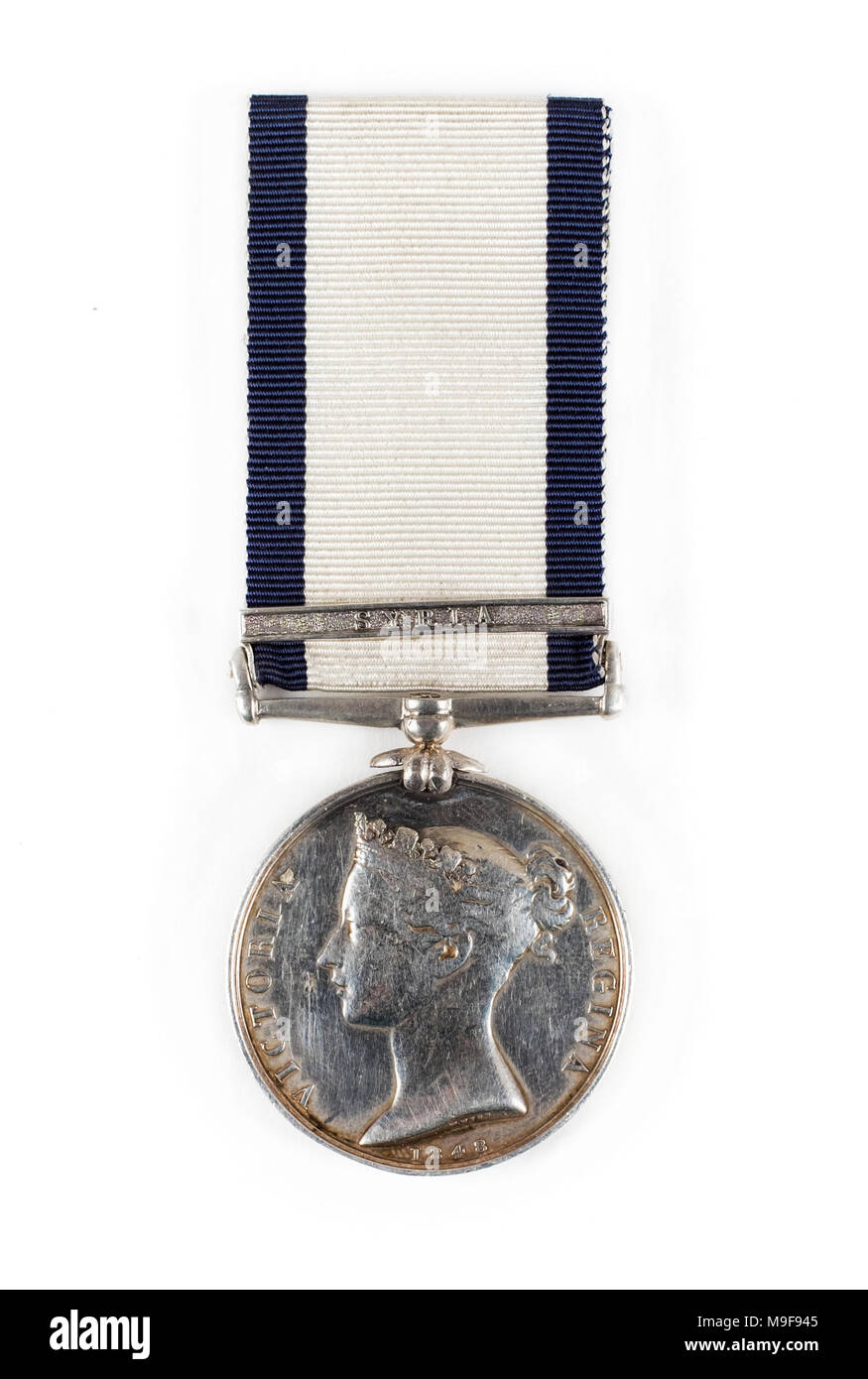 British Naval General Service Medal (NGSM) with Syria clasp to Jeremiah Sutton who served on HMS Pique as an Orderly during the Second Syrian War. Stock Photo