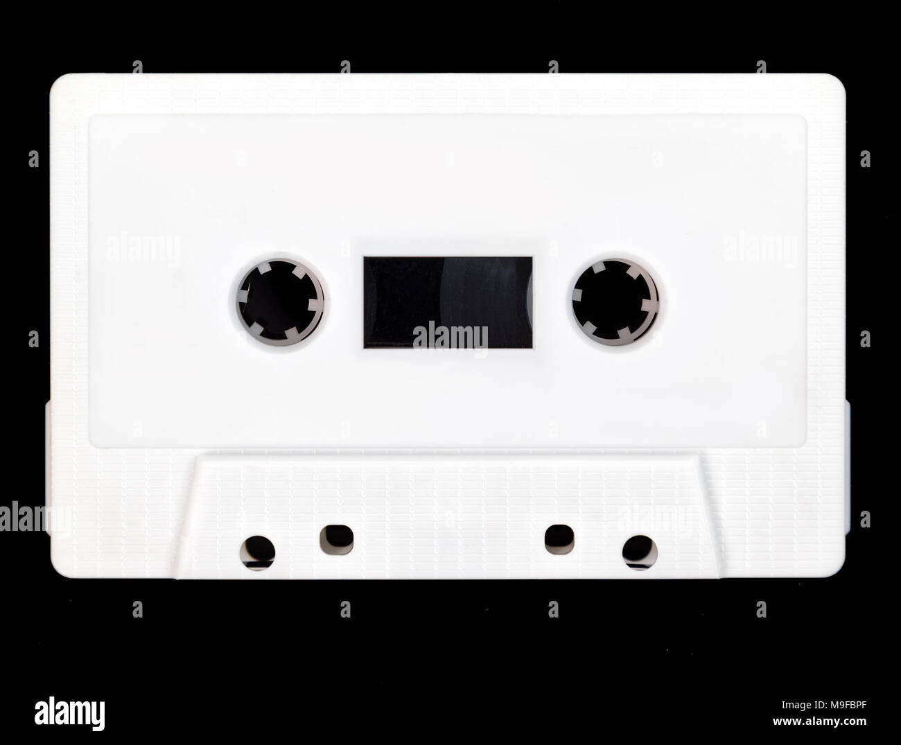 Vintage white audio cassette tape on a black background. Stock Photo