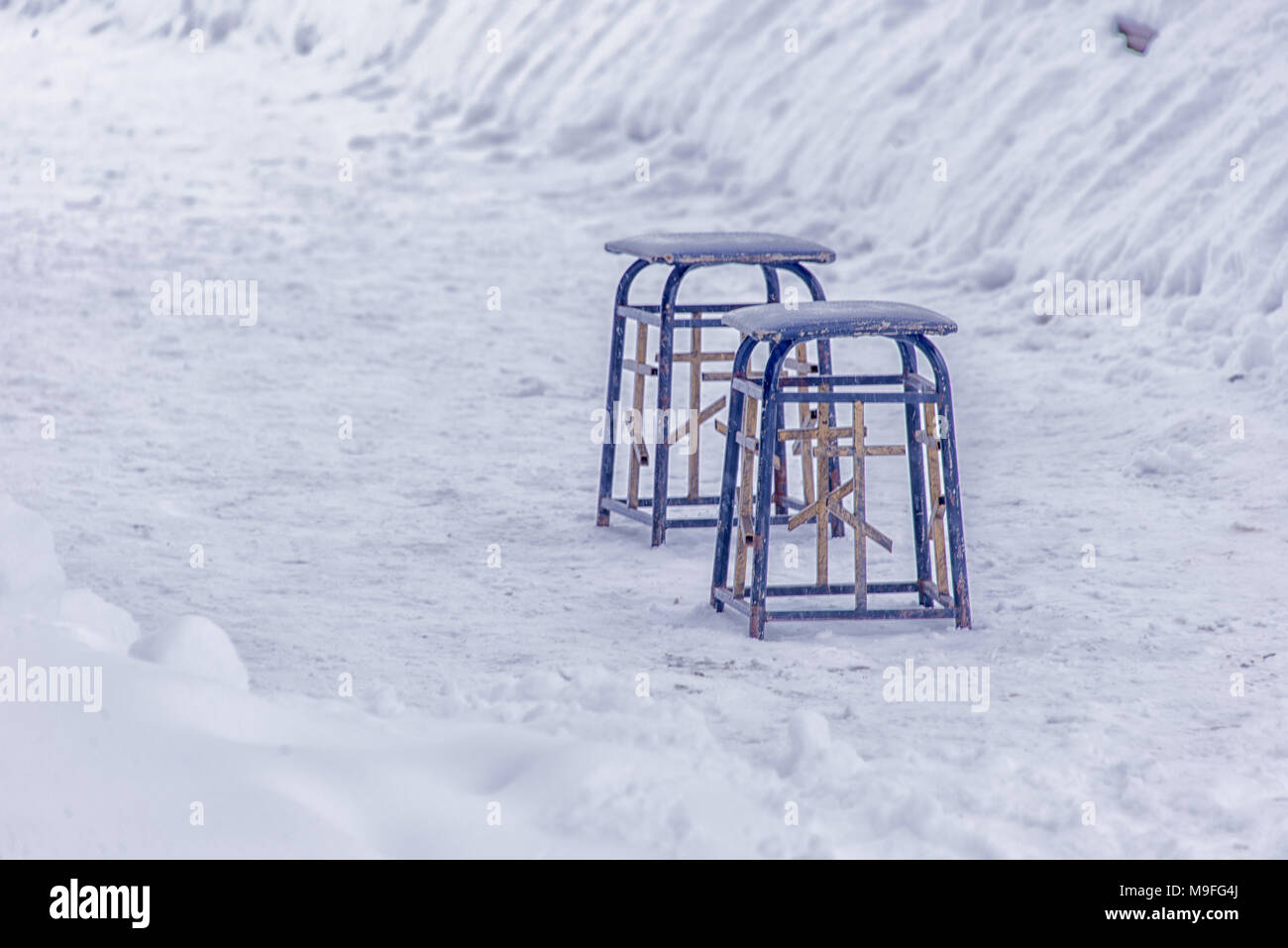 two chairs in the snow, Church chairs with crosses Stock Photo - Alamy