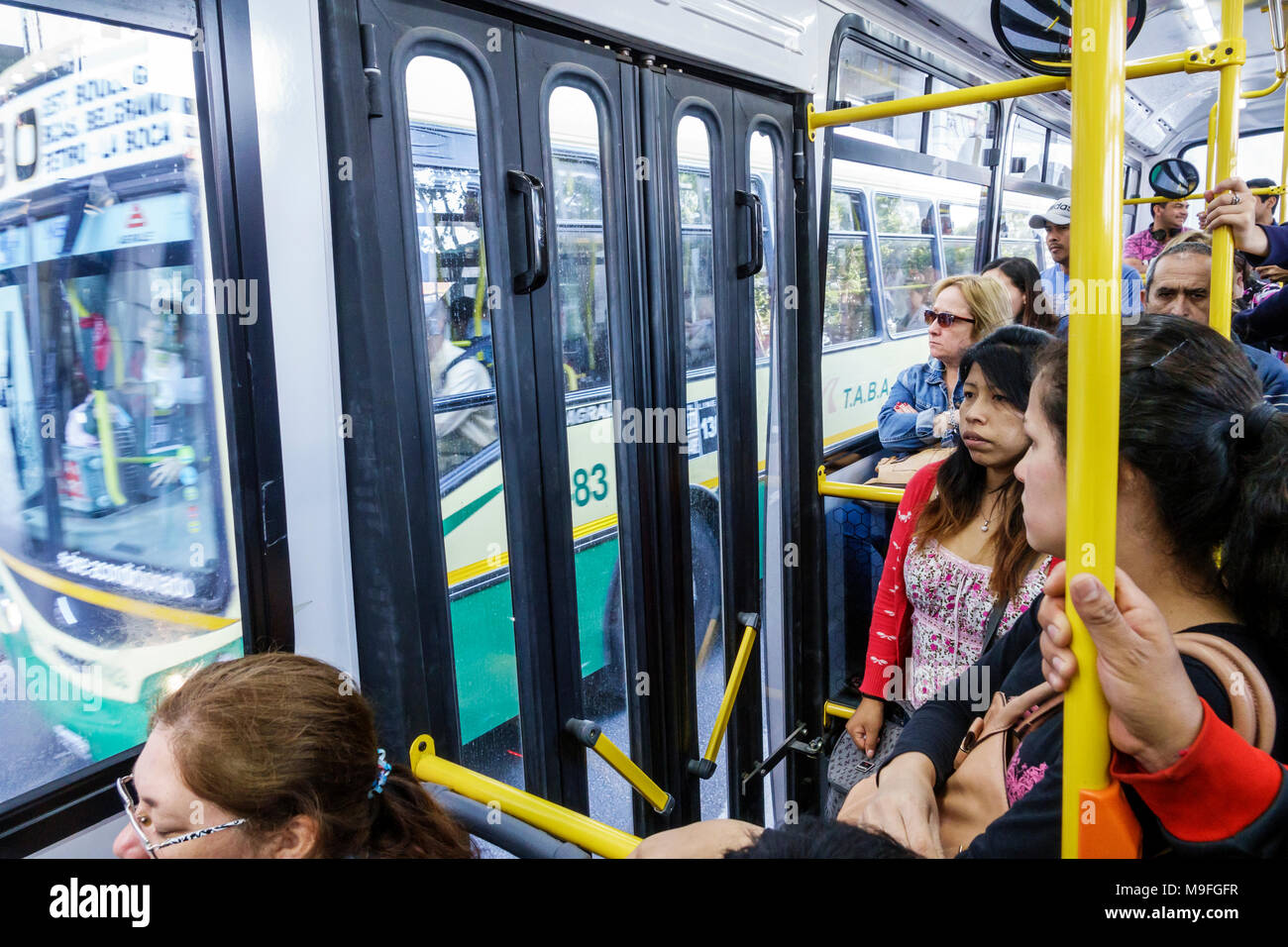 Buenos Aires Argentina,bus,public transportation,passenger passengers rider riders,adult adults woman women female lady,visitors travel traveling tour Stock Photo