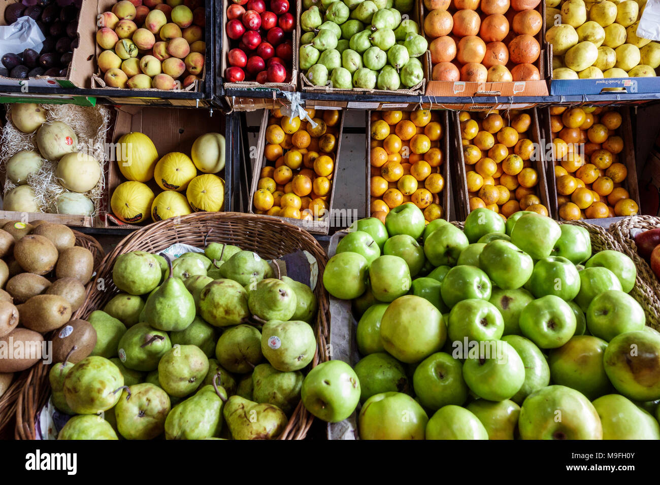 Buenos Aires Argentina,Verduleria de las Luces,greengrocer,produce market,fruit crates,pears,apples,oranges,kiwi,shopping shopper shoppers shop shops Stock Photo