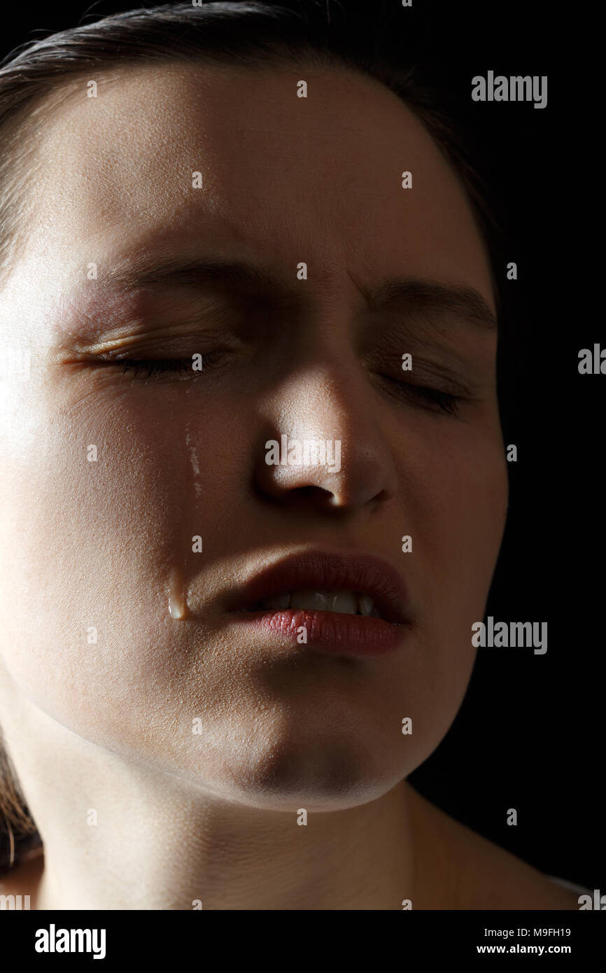 sad woman crying on black background, closeup portrait Stock Photo - Alamy