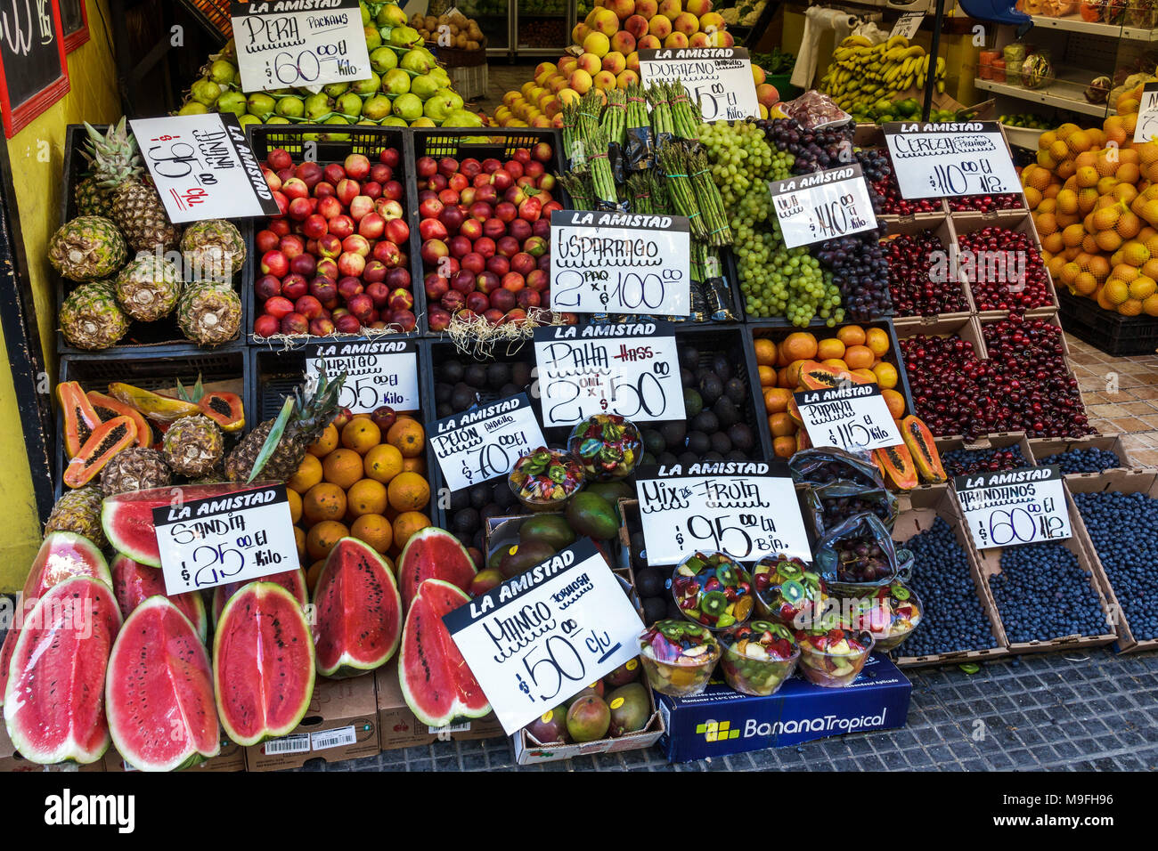 Buenos Aires Argentina,Belgrano,produce fruit market,Spanish language sign,kilo,Kg,display,melon,nectarines,pears,oranges,papaya,cherries,plums,Hispan Stock Photo