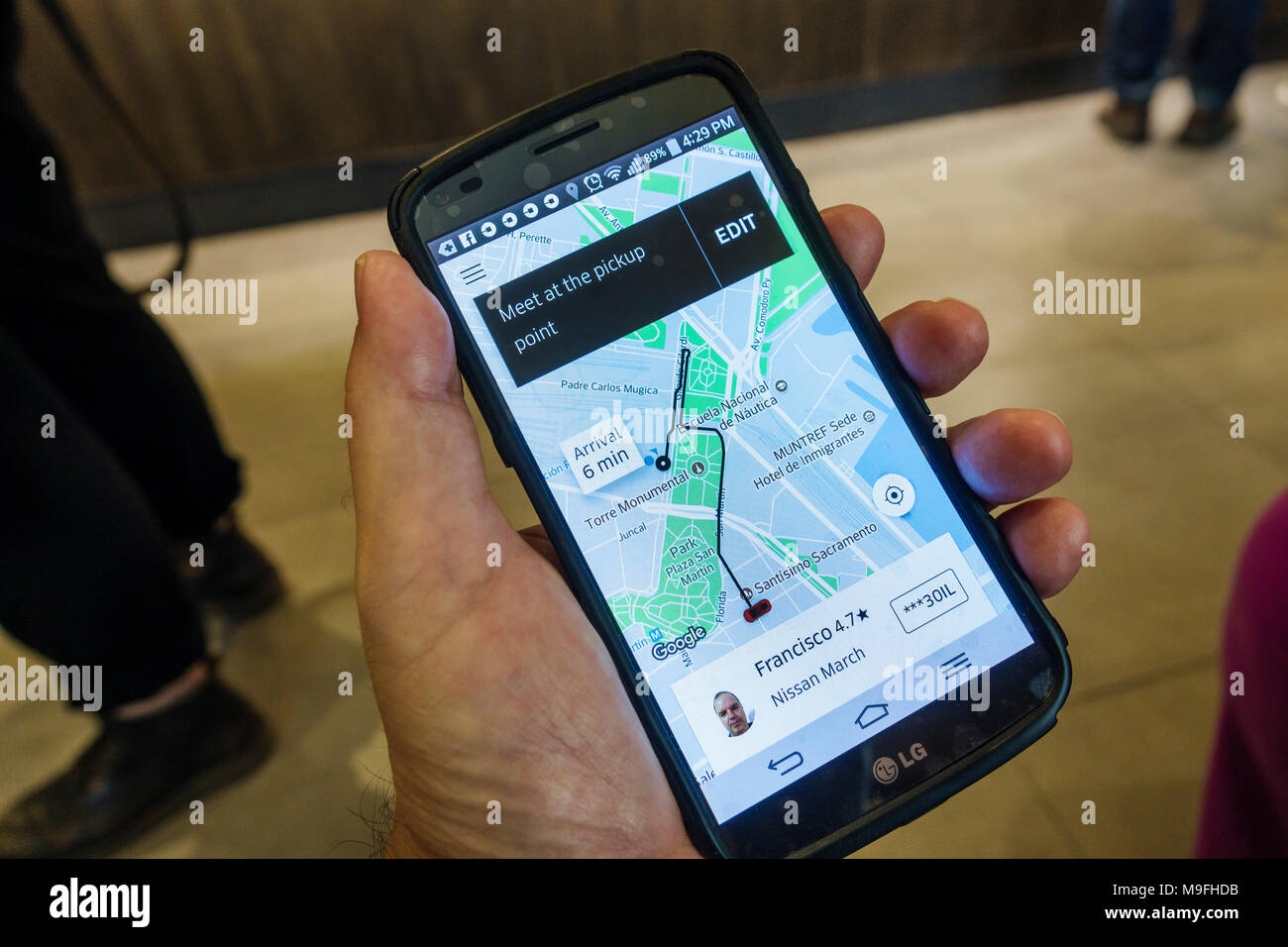 Buenos Aires Argentina,smartphone cell phone phones  texting,Uber,peer-to-peer ridesharing,GPS map,Highway Route,pickup  point,ride,driver,app,Hispanic Stock Photo - Alamy