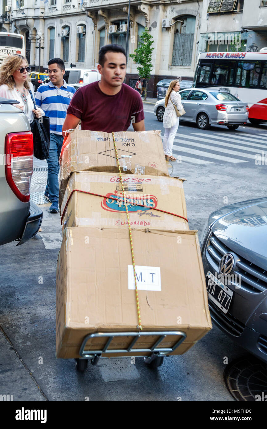 Buenos Aires Argentina,Microcentro,delivery,man men male,pushing,dolly,cardboard boxes,job,manual labor,Hispanic,ARG171128393 Stock Photo