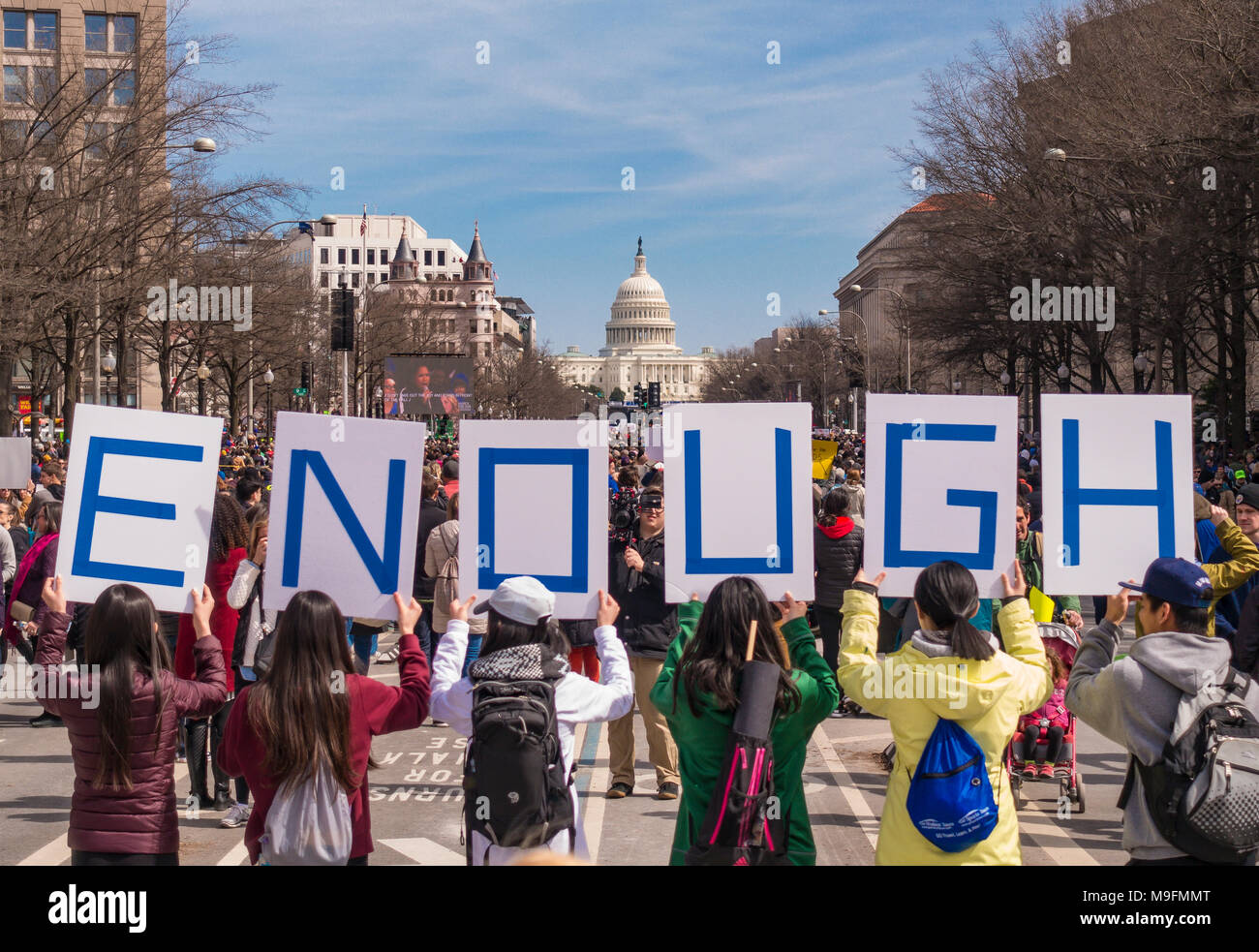 WASHINGTON, DC, USA - March for Our Lives demonstration, protesting gun violence. People hold ENOUGH signs. Stock Photo