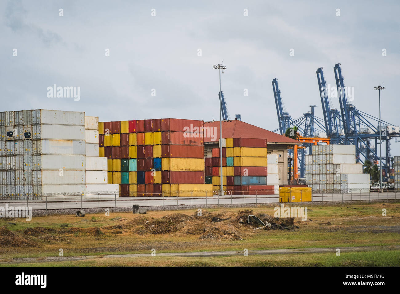 stacked container and cranes at harbor freight concept Stock Photo