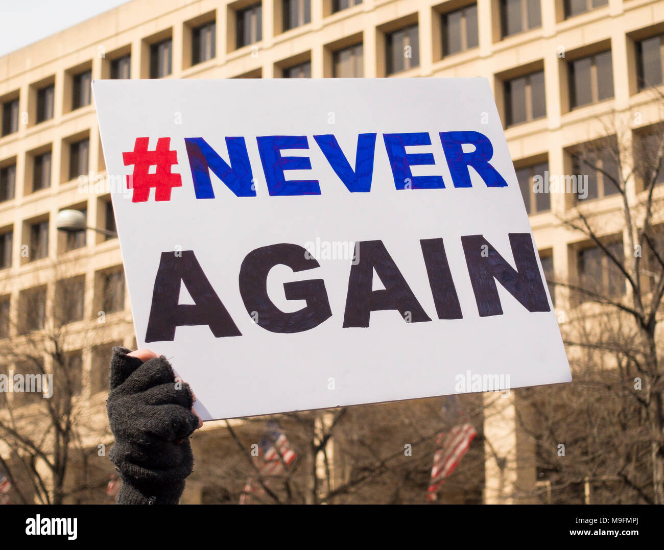 WASHINGTON, DC, USA - March for Our Lives demonstration, protesting gun violence. Never Again sign. Stock Photo