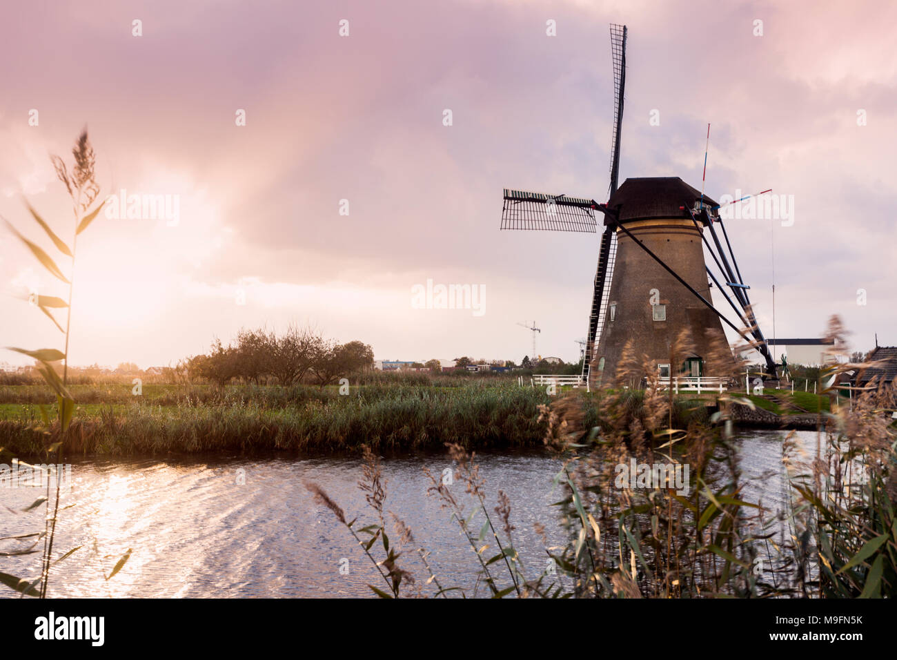 Windmills at Kinderdijk at sunset. Kinderdijk, South Holland, Netherlands Stock Photo