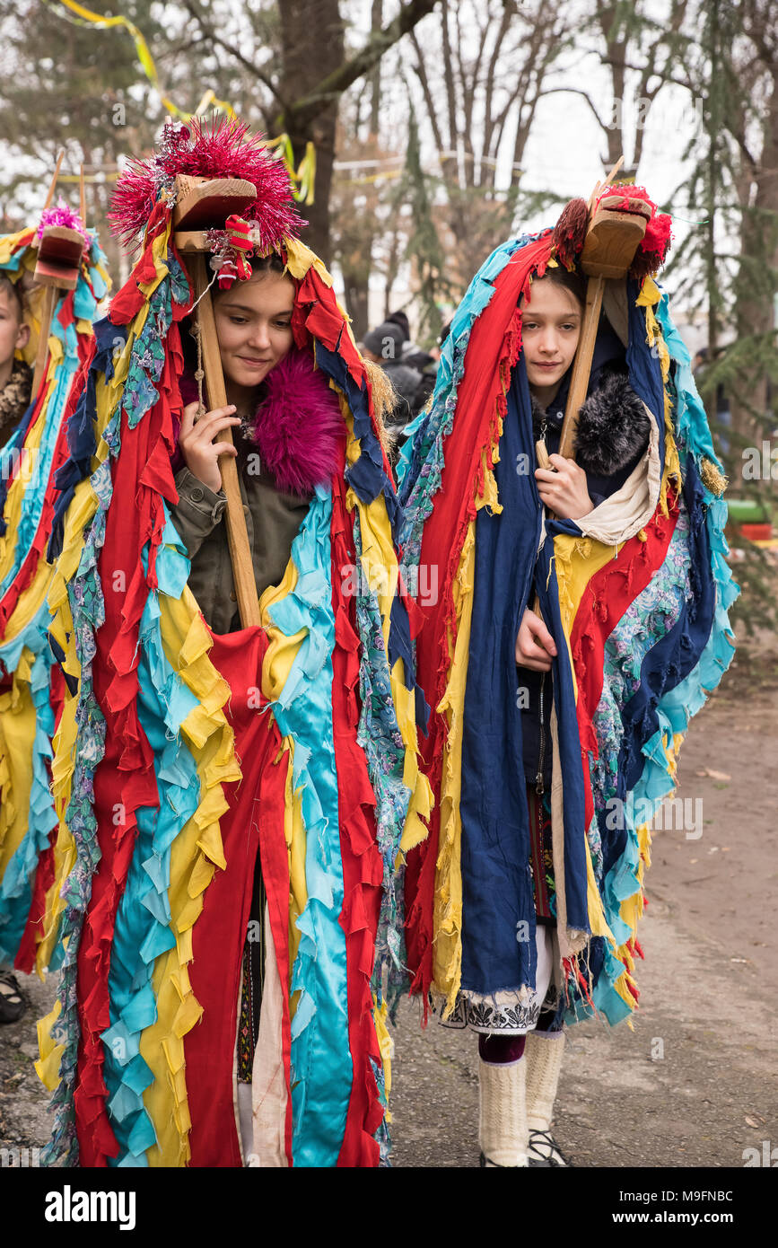 People in traditional carnival costumes at Kukeri festival kukerlandia Yambol, Bulgaria. Participants from Romania Stock Photo