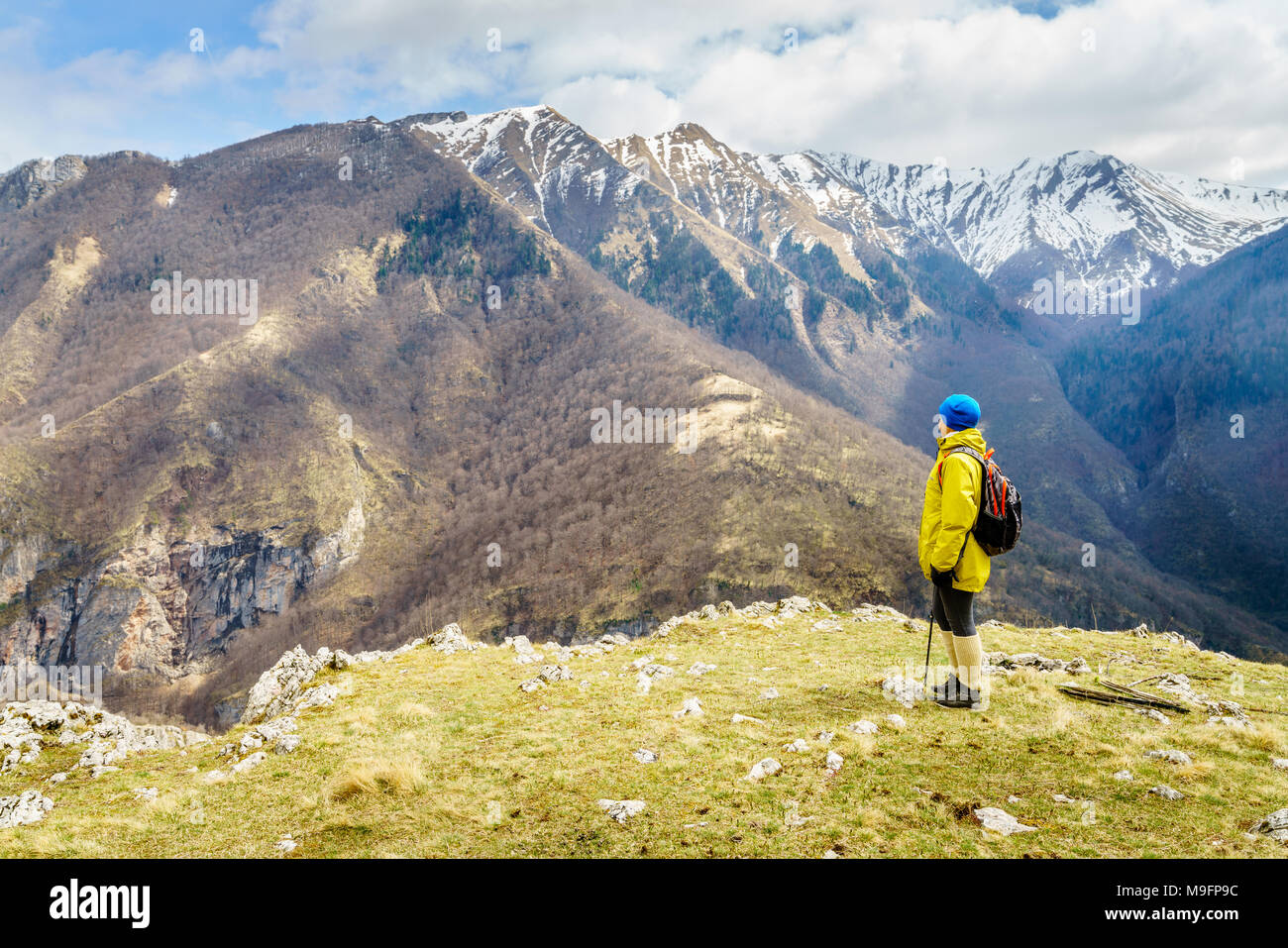 Woman is hiking in Dinaric Alps near Sarajevo, Bosnia-Herzegovina Stock Photo