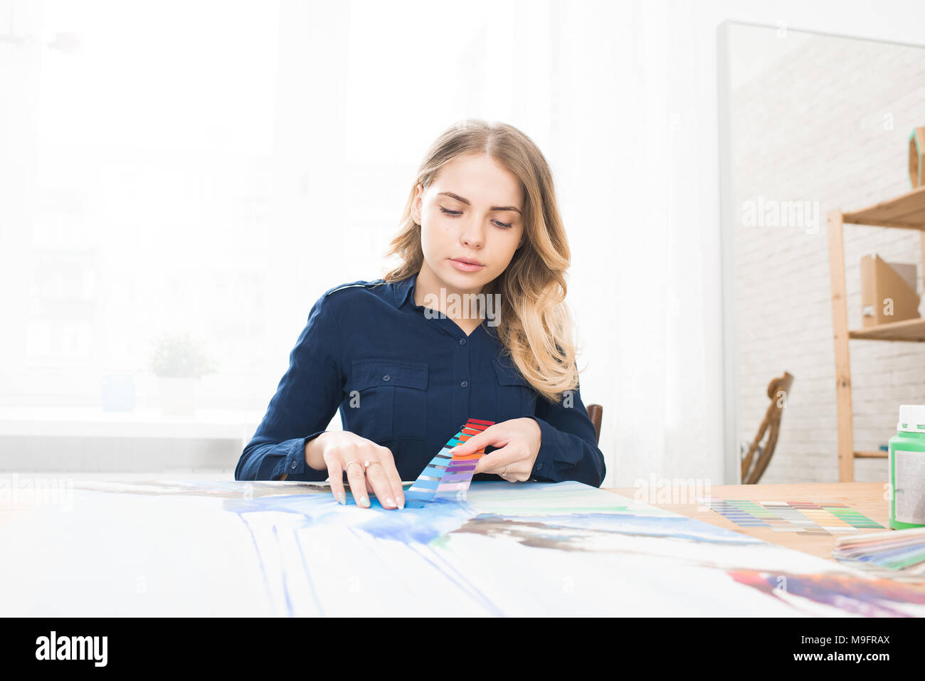 Designer with samples Stock Photo