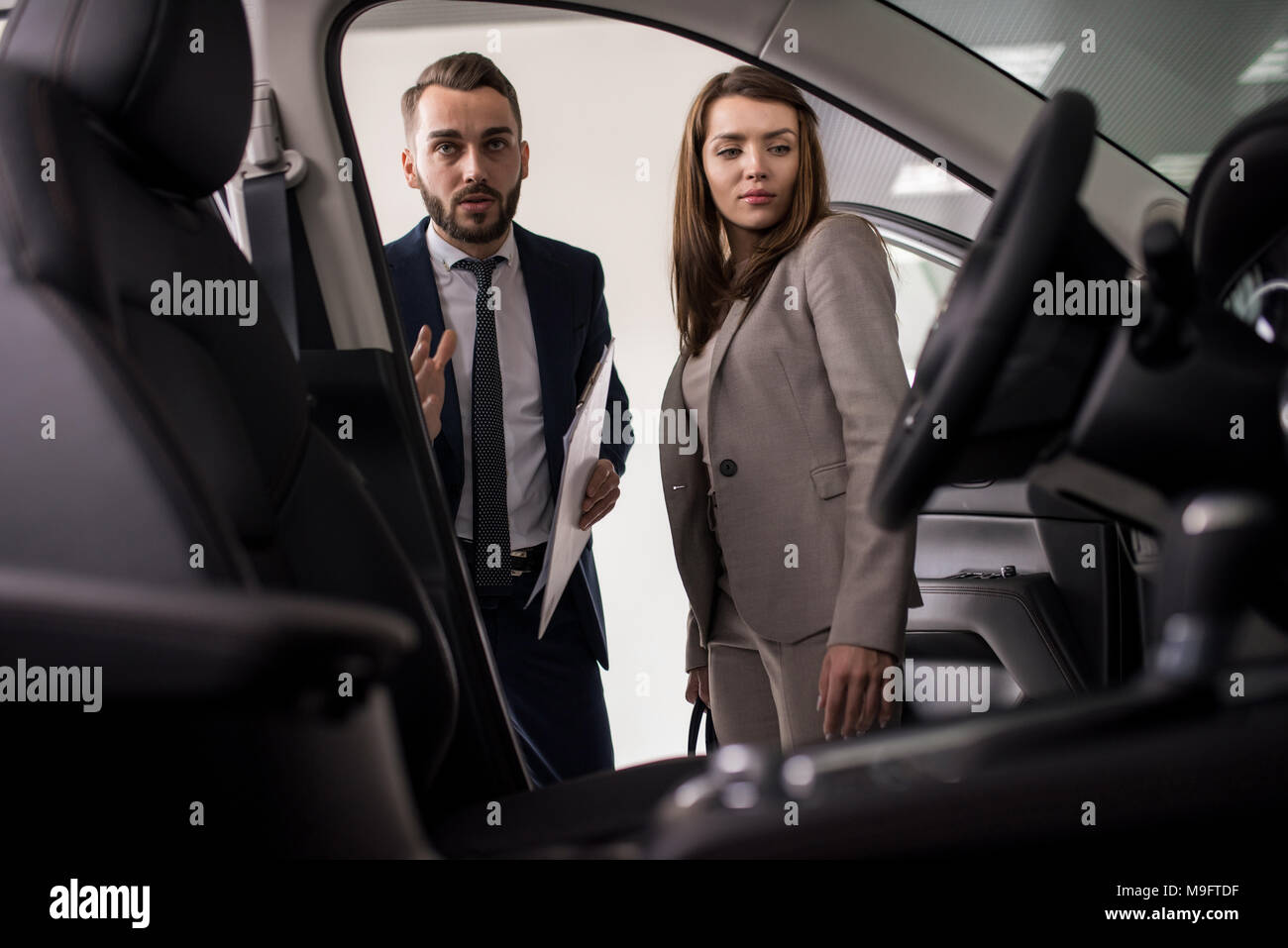 Salesman Presenting Luxury Car Stock Photo Alamy