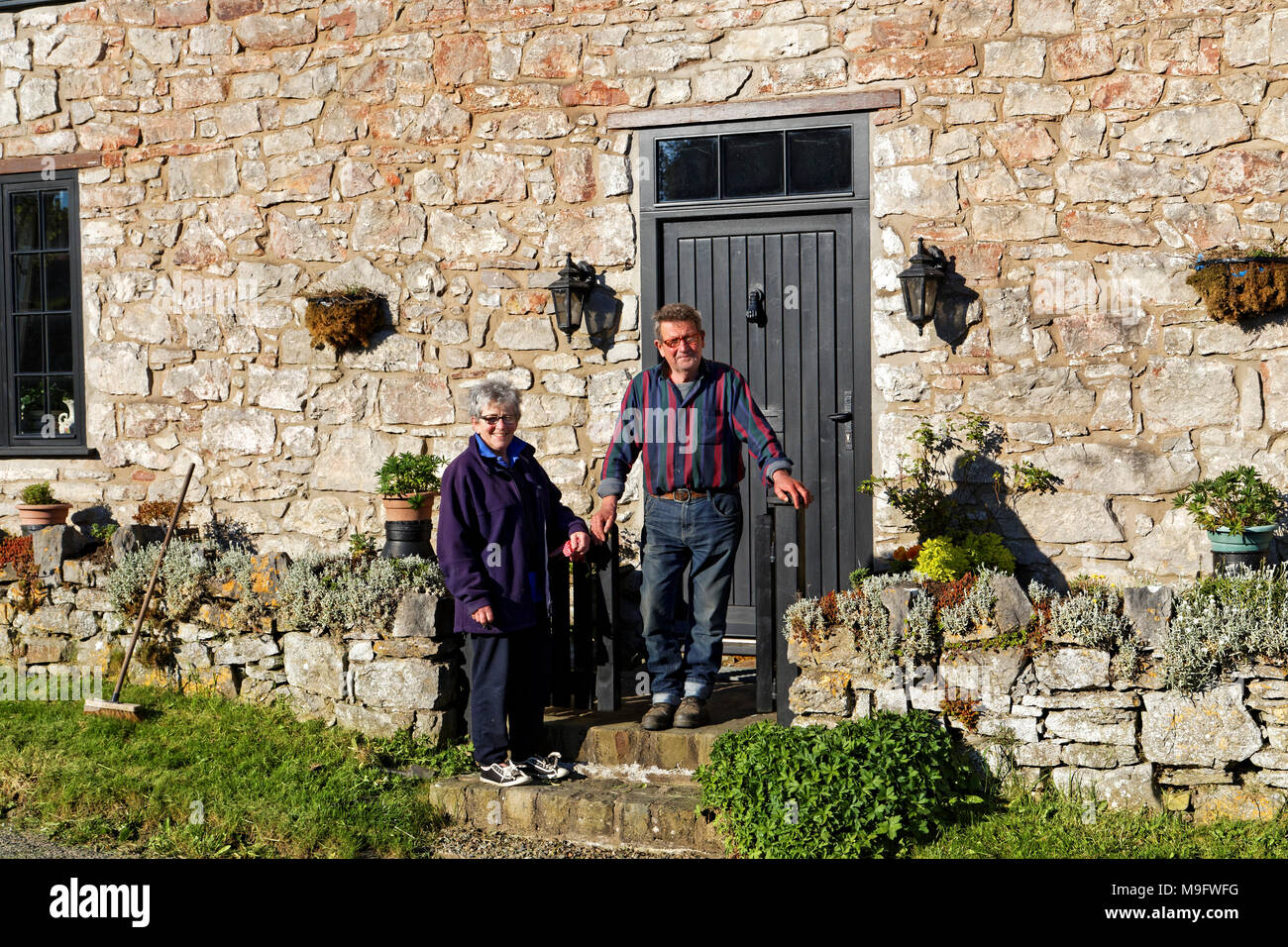 42,506.01578 couple living in a 3-story 500 yr old stone house, that was once a pub tavern Stock Photo