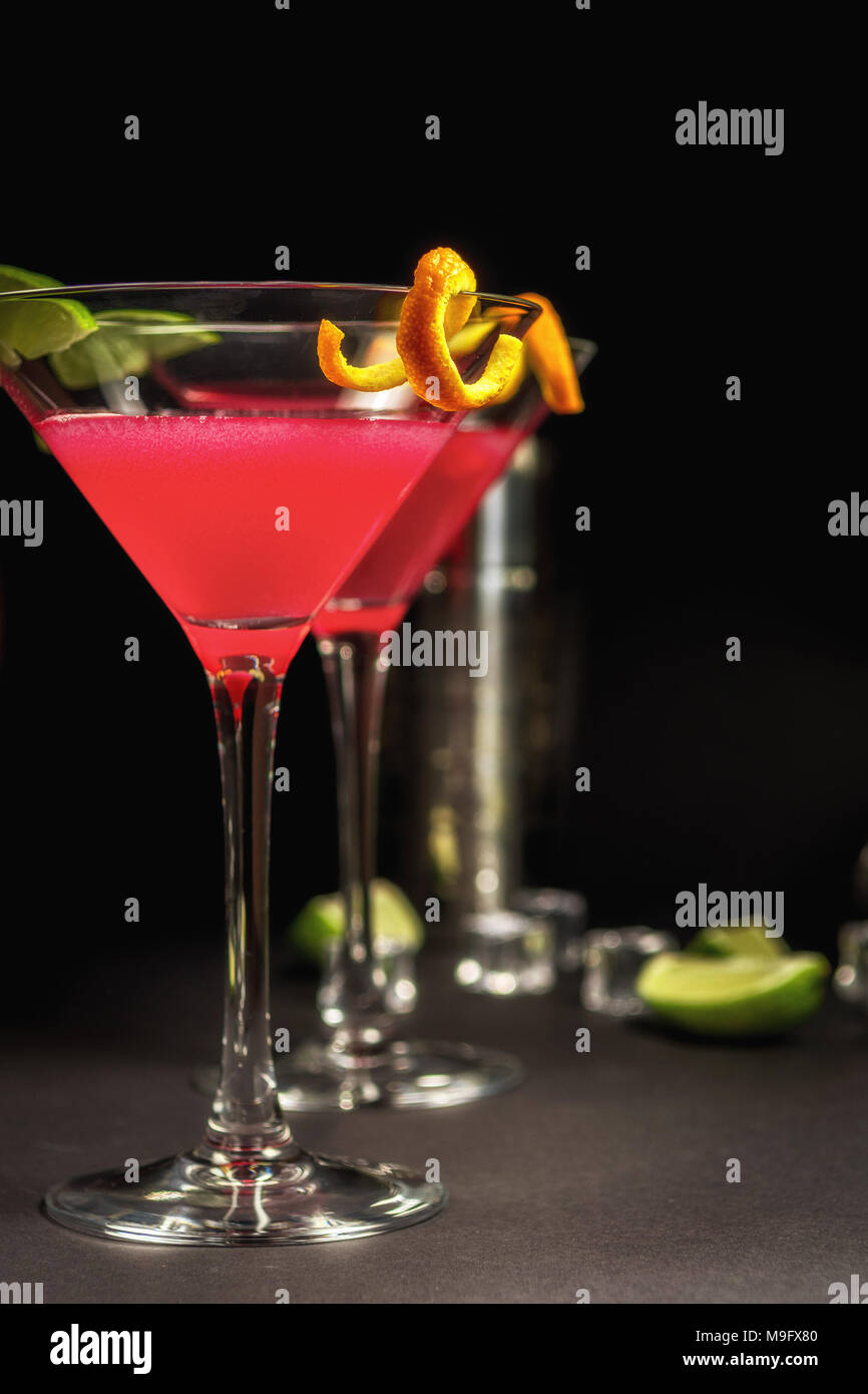 Alcohol drink cocktail Cosmopolitan with lime on black background Stock Photo