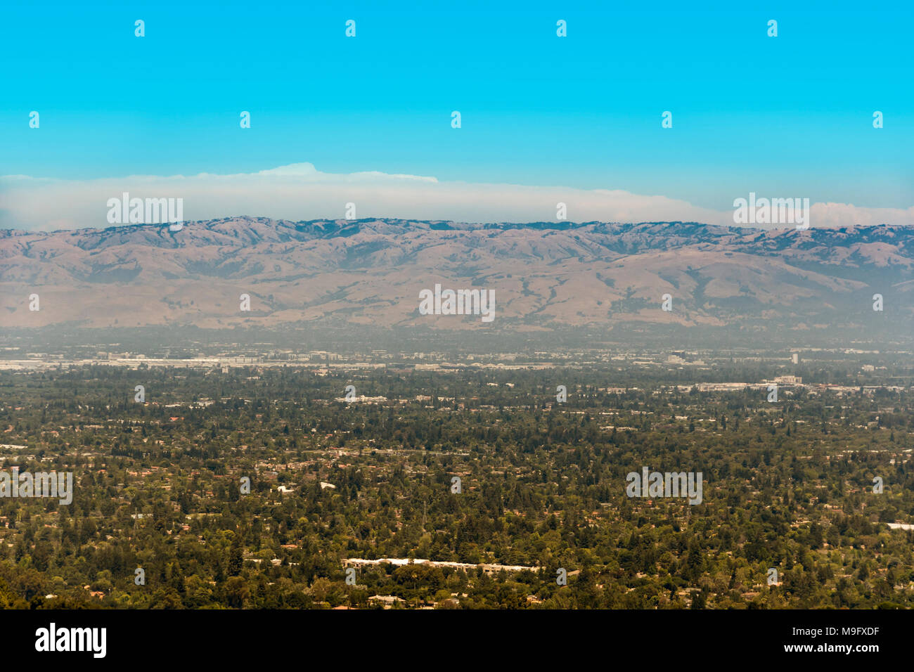 South San Francisco Bay, also called Silicon Valley, with visible smog above the area on a sunny day. The part we see on the image is south San Jose. Stock Photo