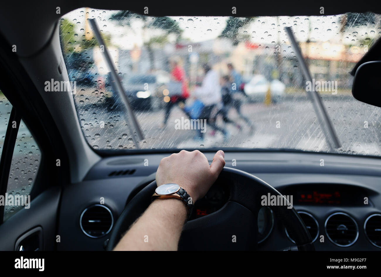 driver and a pedestrian at a crosswalk on rainy day Stock Photo - Alamy