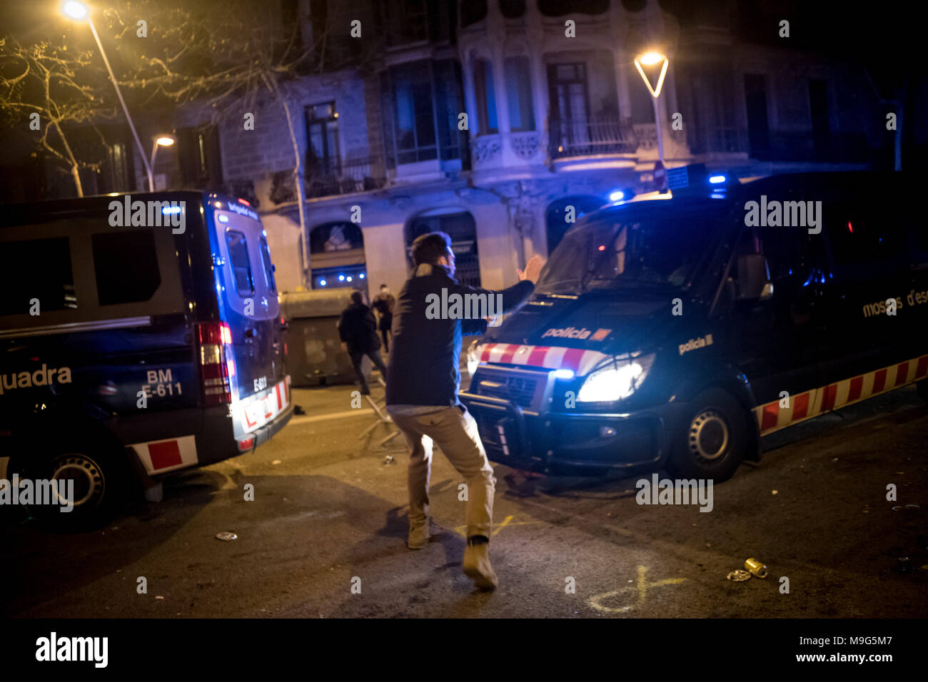 Barcelona, Catalonia, Spain. 25th Mar, 2018. A riot police van is about to run over a demonstrator in Barcelona. Protests erupted on the street of Barcelona after deposed Catalan president Carles Puigdemont was arrested by German police on an international warrant. Credit: Jordi Boixareu/ZUMA Wire/Alamy Live News Stock Photo