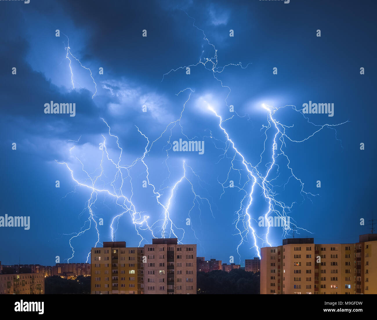 Many Lightnings Over Housing Estate. Night Storm in the City. Stock Photo