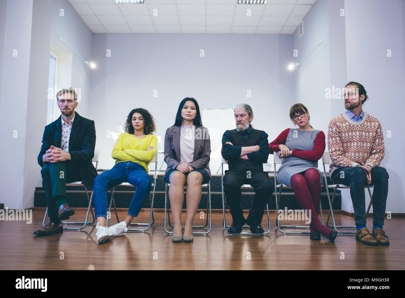 group therapy: diverse people talking and giving support Stock Photo