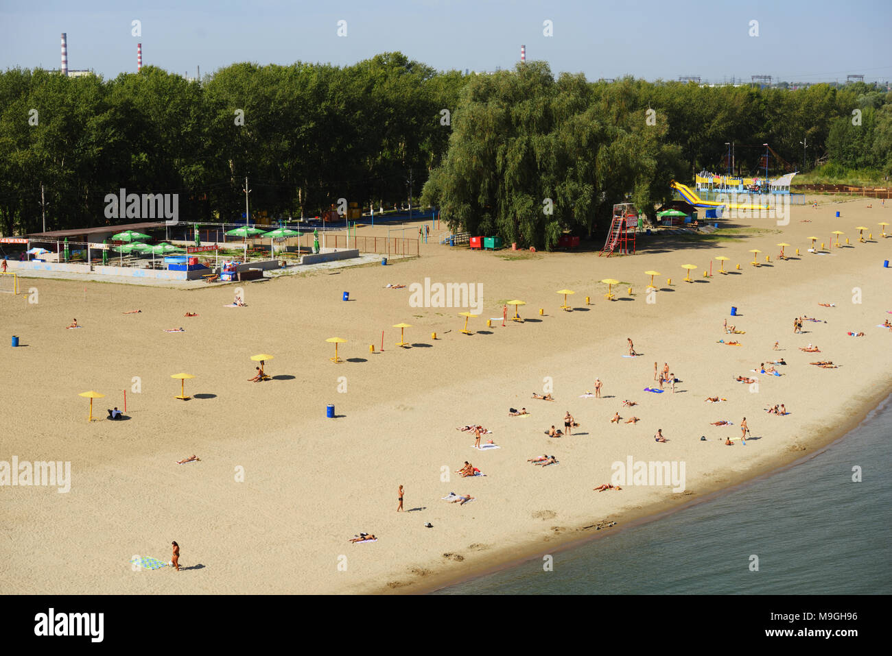 Novosibirsk, Russia - August 24, 2014: People resting on the beach Nautilus on the left bank of Ob river. It is the main city beach of Siberia's capit Stock Photo
