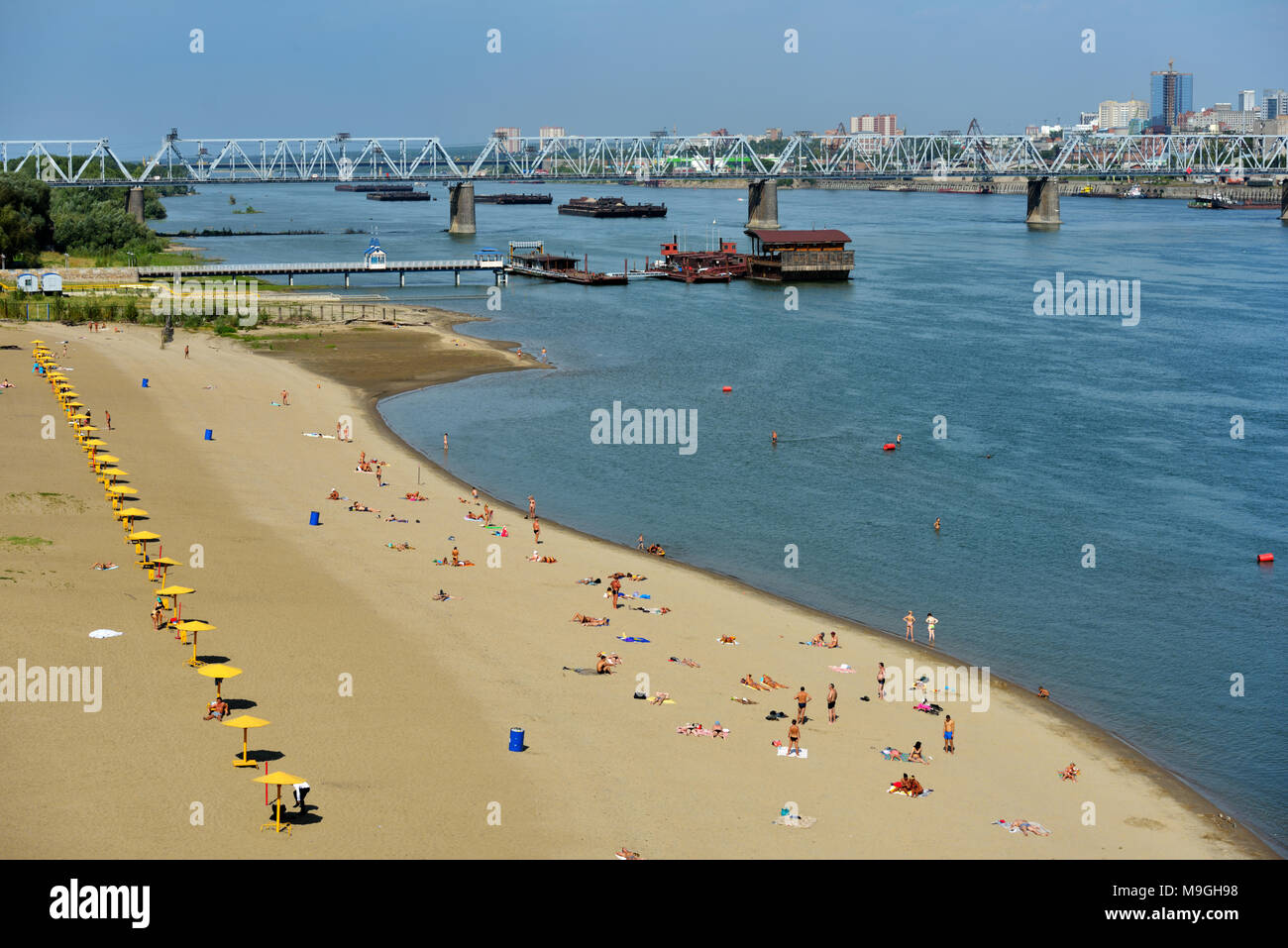 Novosibirsk, Russia - August 24, 2014: People resting on the beach Nautilus on the left bank of Ob river. It's the main city beach of Siberia's capita Stock Photo