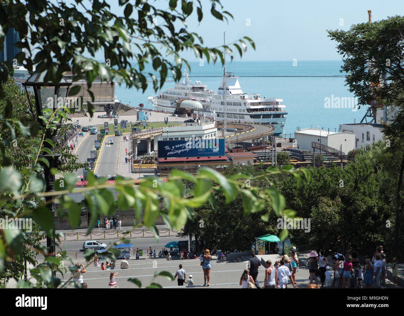 Odessa, Ukraine - July 22, 2012: People descending to the port where the passenger ship is moored. Stock Photo
