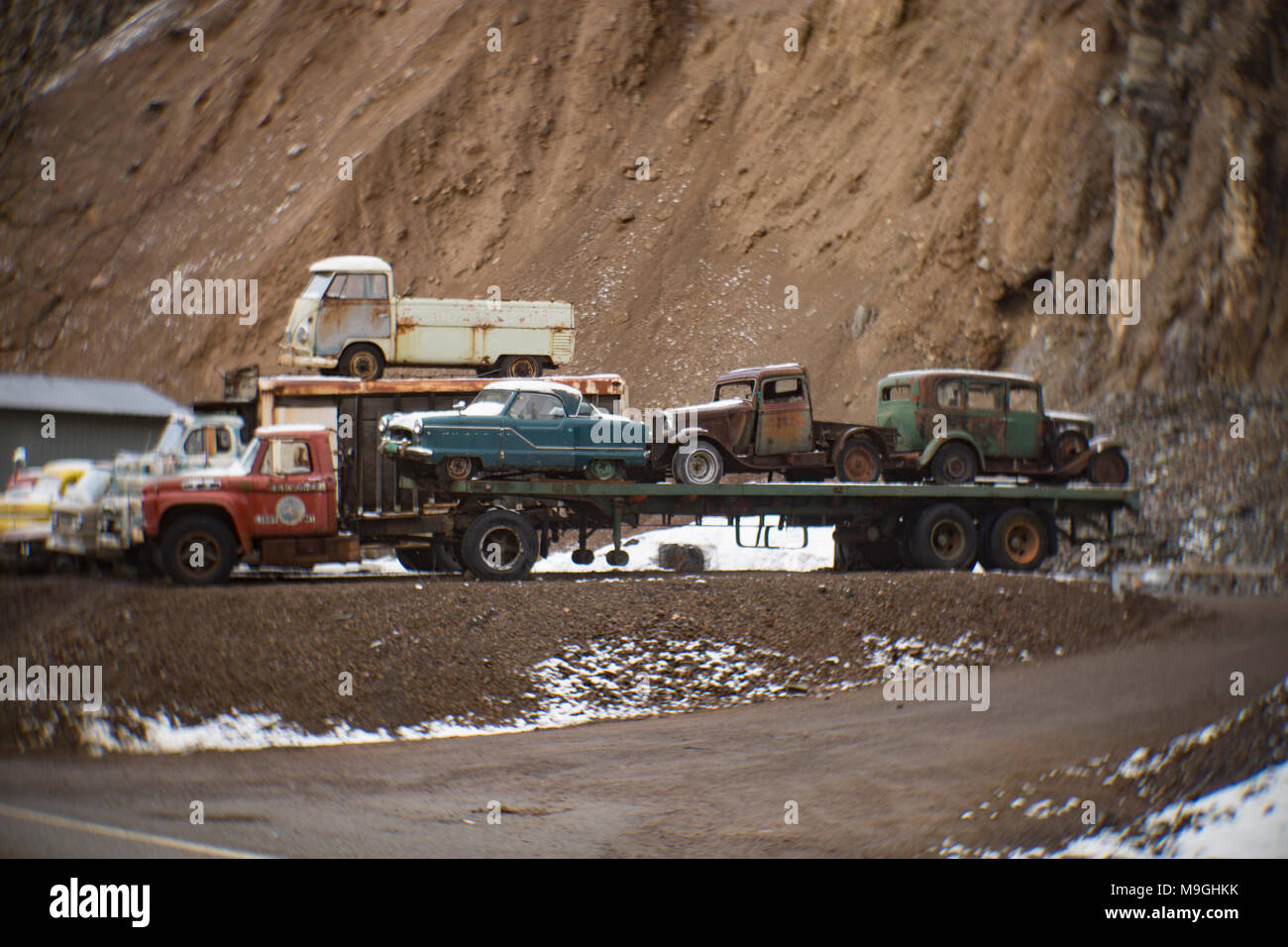 A line of old rusty car and trucks from the 1920s through 1960s, in an old quarry, east of Clark Fork Idaho.  This image was shot with an antique Petz Stock Photo