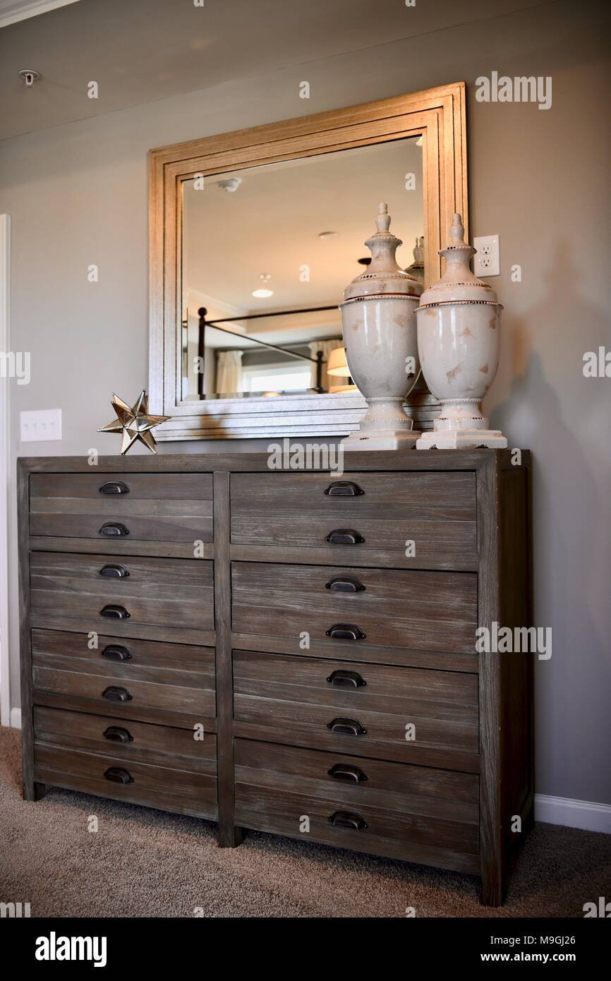 View Of Bedroom Dresser Inside A Decorated Modern Home Stock Photo