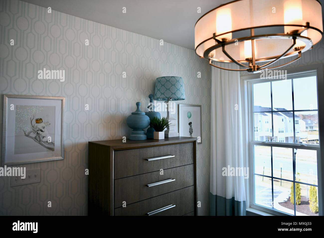View Of Bedroom Dresser Inside A Decorated Modern Home Stock Photo