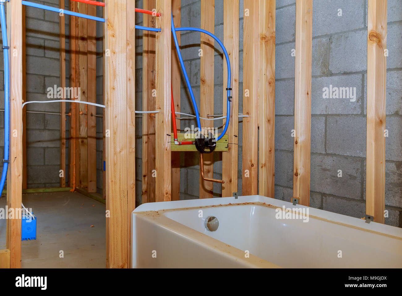 Bathroom remodel showing under floor plumbing work connecting old ...