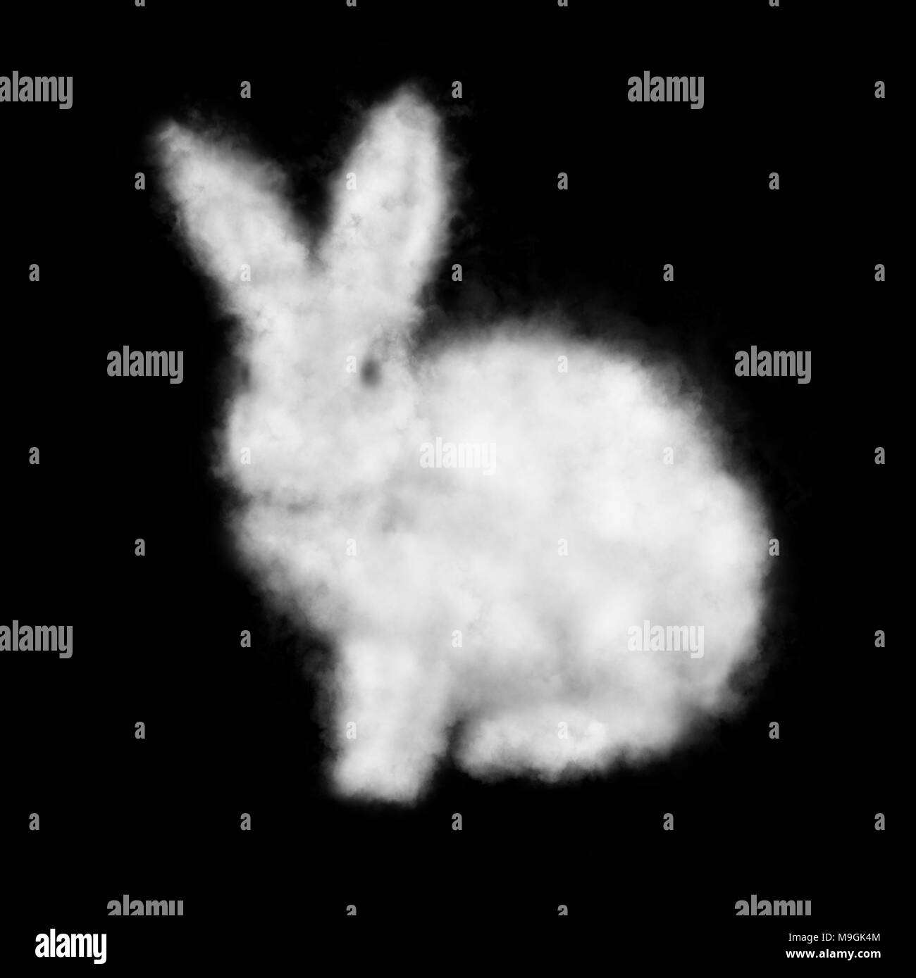 White cloud in the shape of a rabbit isolated on a black background Stock Photo